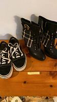 Diesel ankle boots and Vans sneakers side by side