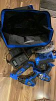 Bag open with tools, charger visible