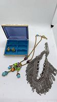 Entire lot showing both necklaces, earrings in box, and Mele jewelry box