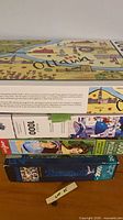Stack showing five puzzle boxes including Ottawa map on top and blue 2000-piece at bottom