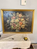 Front view of acrylic floral painting showing full gilded frame and bouquet subject