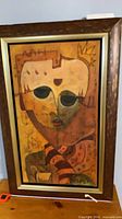 Frontal view of framed painting showing artwork, frame style and visible wear