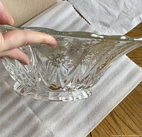 Side profile showing pressed glass facets and silver floral overlay