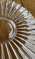 Close-up of fluted pressed glass bowl showing scalloped rim