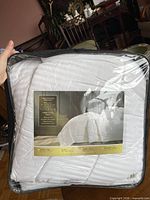 Front view of king duvet insert sealed in zippered plastic bag