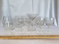 All nine assorted glasses lined together for overview and scale