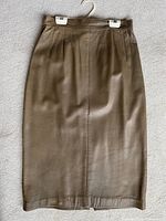 Front view of brown leather pencil skirt on hanger