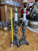 Both lamps standing with tape measure indicating height