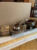 All serveware pieces grouped together showing tray, butter dish, creamer on plate, sugar bowl, ladle