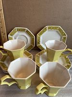 Front angled view of all twelve pieces, showing forms and colors