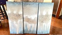 All three matching canvases displayed together