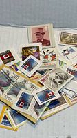 Pile of assorted vintage stamps showing Canadian Maple Leaf designs and other commemoratives