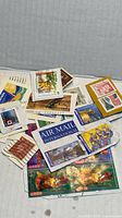 Pile of mixed vintage and modern postage stamps from several countries