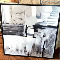 Front view of the abstract painting within black frame