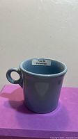 Front view of periwinkle Fiesta mug showing Post 86 Periwinkle label