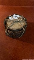 Coaster set tied with rope, bark exterior visible