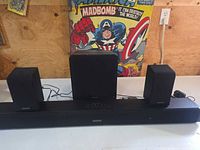 Front view of soundbar with two speakers and subwoofer