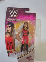 Front view of sealed Nikki Bella WWE Superstars action figure in blister packaging