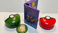 Two disk launchers, Pokémon disk and closed Spyro handheld game