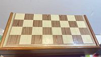 Closed wooden chessboard case top view
