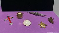 All six jewelry pieces laid out