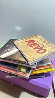 Stack of unsorted CDs, top case Walk Off The Earth R.E.V.O.