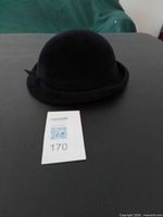 Plain black felt hat with rolled brim