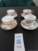 Group shot of the four tea cup and saucer sets