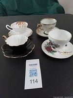 Group shot of four teacup and saucer sets