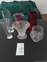 Group shot of all six glass vases