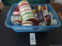 Overall view of basket filled with assorted ribbon spools