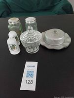 Group shot showing all shakers, sugar bowl and butter dish