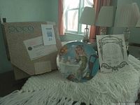 Plate, certificate of authenticity and original box displayed on table