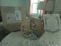 Front view of plate, COA and box visible