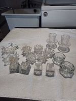 Group shot of all 15 candle holders displayed on white surface