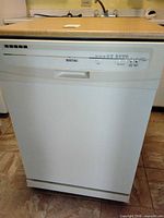 Front view showing brand logo, control panel, overall exterior condition