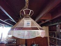 Full view of stained glass pendant lamp hanging from ceiling