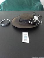 Hat and headband displayed on table