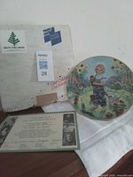 Front view of plate with certificate and box