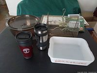 Group shot of pot, letter holder, baking dish, travel mugs and picture frames