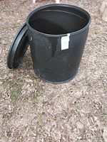 Barrel standing with lid leaning; shows overall shape and color