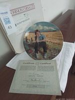 Plate with original box and certificate visible