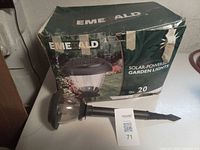 Retail box showing Emerald solar-powered garden lights, 20 count