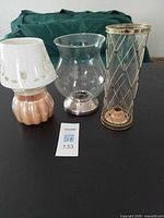 All three candle holders on table