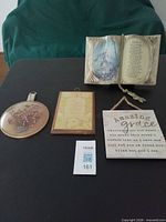 All four wall hangings displayed on table