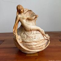 Full view of ceramic vase with nymph figure