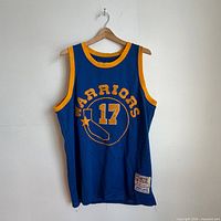 Front view of Warriors jersey showing logo, number 17, overall condition