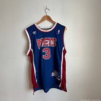 Full front view of jersey on hanger