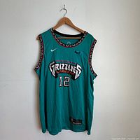 Front view of teal Ja Morant Grizzlies jersey on hanger