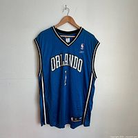 Front view of blue Orlando Magic #1 jersey showing brand tag and size XL